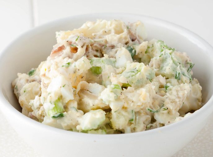 Homemade potato salad with red potatoes and celery.