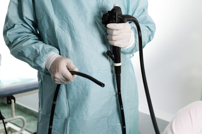 Endoscopy. Doctor holding endoscope before colonoscopy