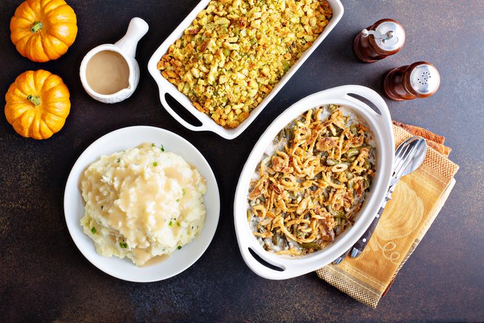 All traditional Thanksgiving side dishes, mashed potatoes, green beans and stuffing