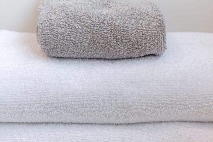 White and gray folded towels extreme closeup