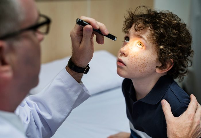 Young boy having his eyes checked