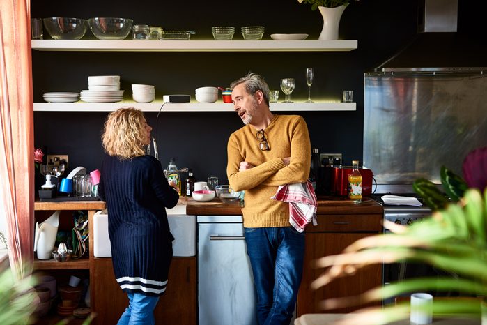 mature couple having a conversation in the kitchen
