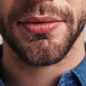 close up of man's mouth and beard