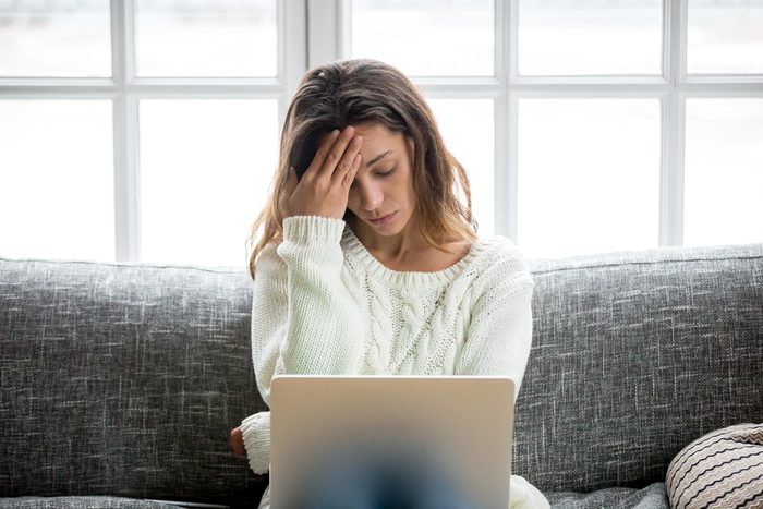 woman stressed looking at her computer
