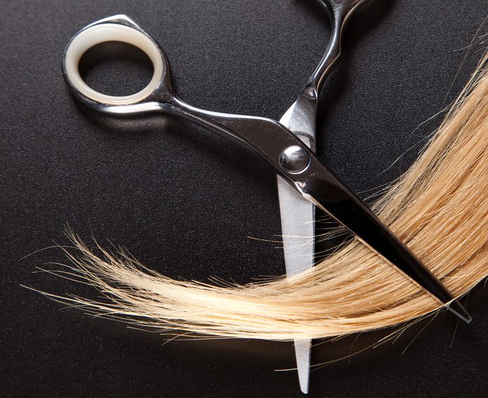 professional hairdresser scissors on dark background