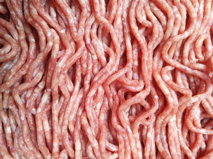 Close-up photo of raw minced meat / mince /ground meat. Textured food background.
