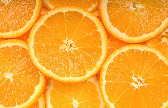 Close up slice orange fruit background texture.