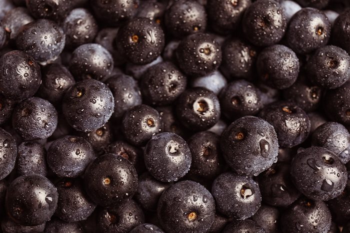 Fresh acai berries as background
