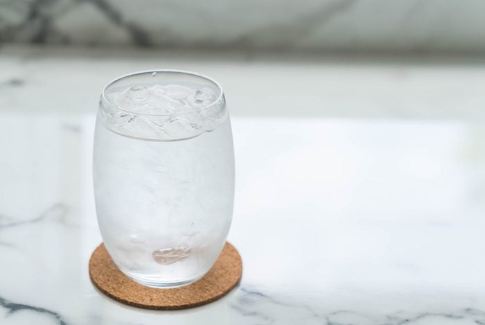 a glass of water with ice