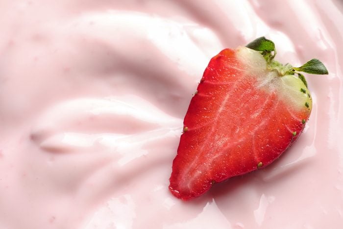 Tasty fresh yogurt with strawberry, closeup