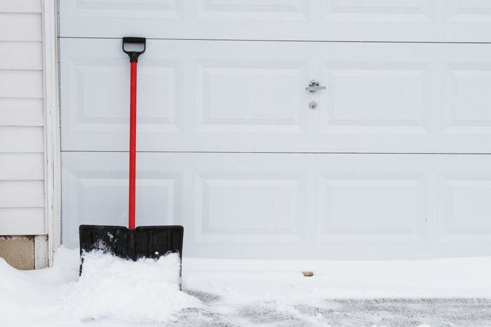 snow shovel on garage door