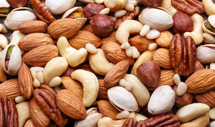 Mixed nuts background closeup. Natural organic food.