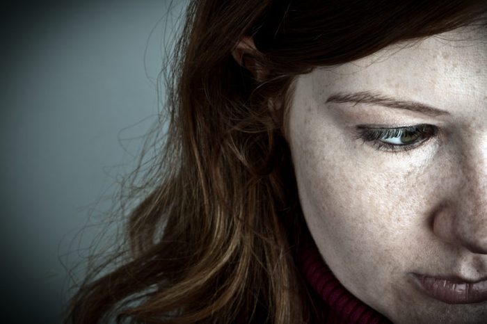 pale red headed woman with freckles