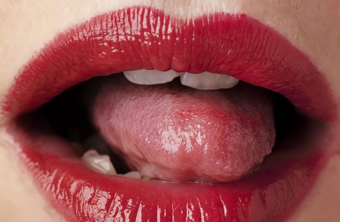 close up image of womans red lips