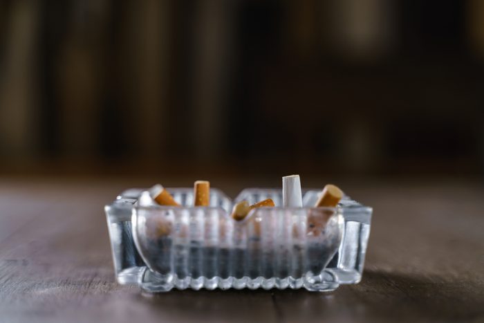 Glasses cigarette ash tray on wooden table