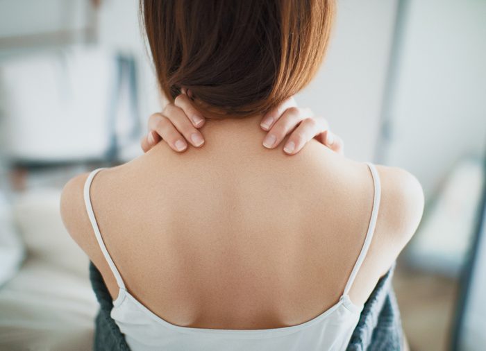 Woman with neck pain, stiff neck
