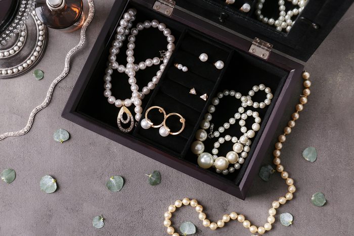 Jewelry and box on gray background