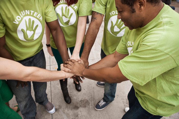 volunteers holding hands