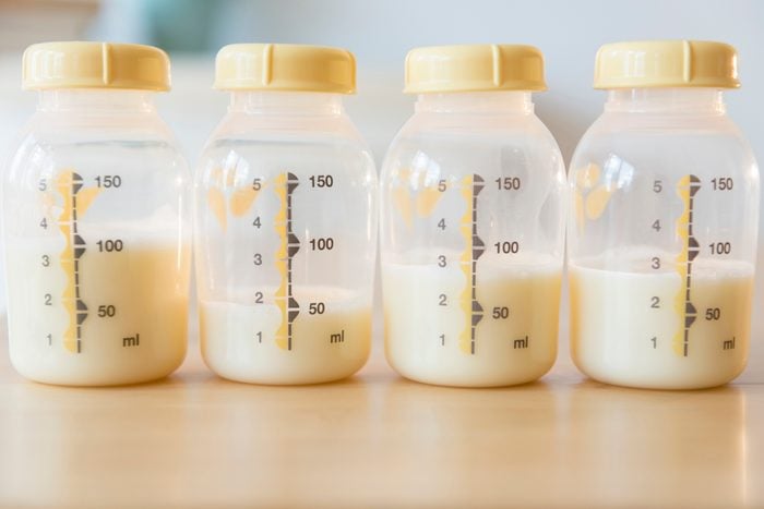 baby bottles filled with breast milk