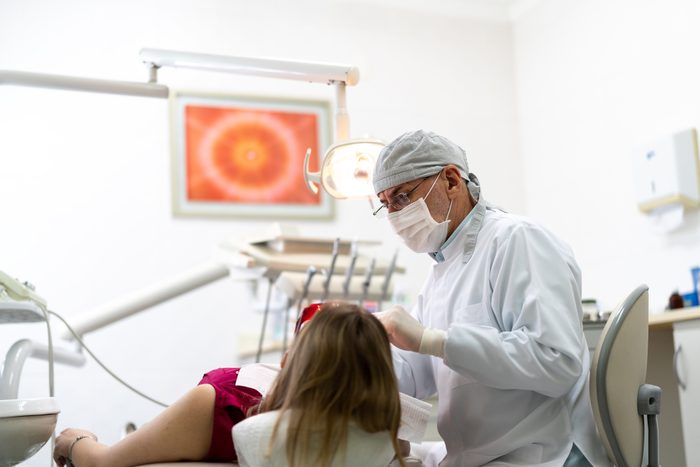 dentist with female patient