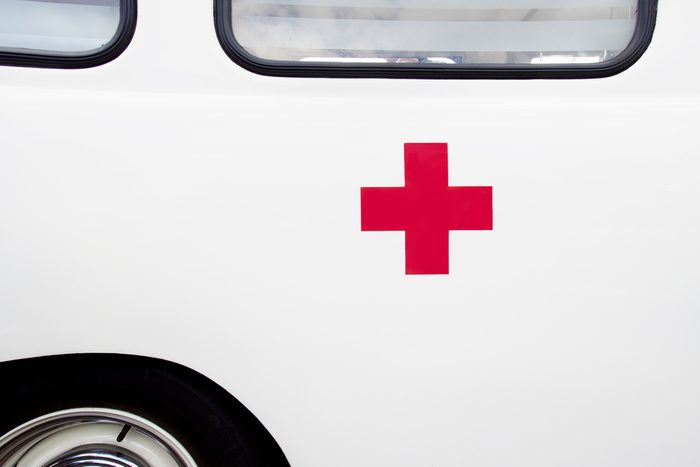 Close up of a red cross on a vintage ambulance