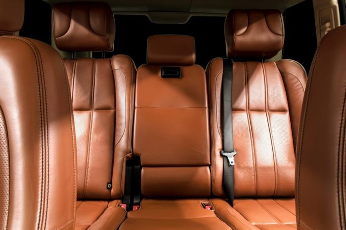 Business car interior. with brown rear leather seats.