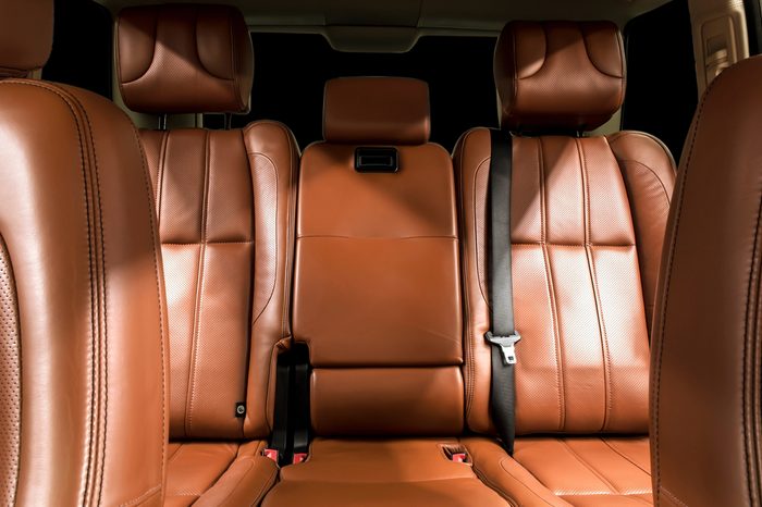 Business car interior. with brown rear leather seats.