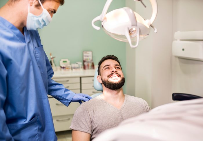 man at the dentist smiling