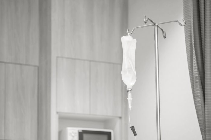 Closeup saline bag in hospital room background in black and white tone