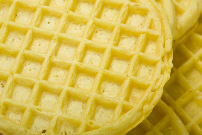Frozen buttermilk waffles background; close up, macro view