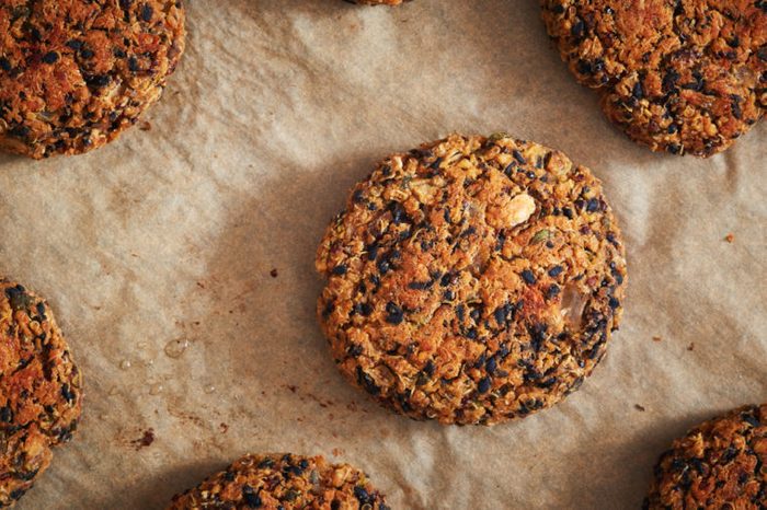 Vegan quinoa and bean burgers made with beans, quinoa, nori algae, oats, smoked peppers and onions