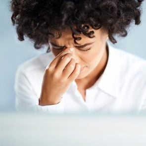 black woman sinus headache pressure stress