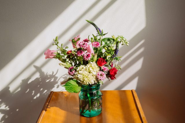 flowers in vase sitting on table