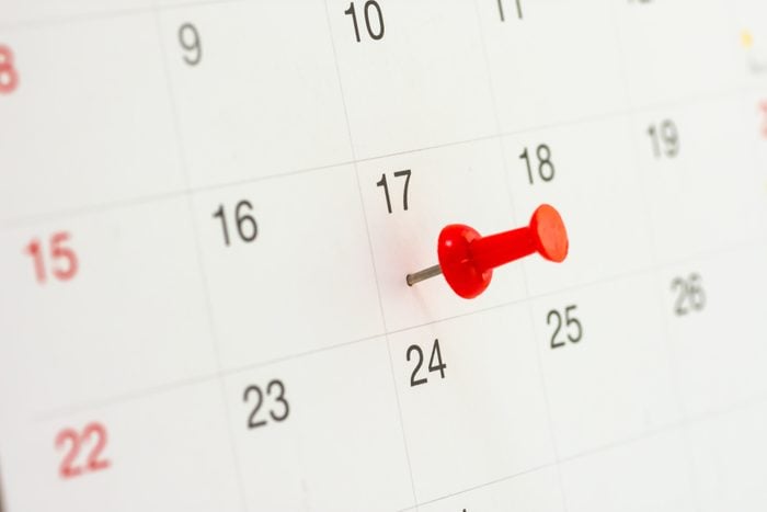 Red push pin on calendar in 17th of month. Red thumbtack a date on calendar or planner. Tax Day 2018 takes place on April 17, 2018