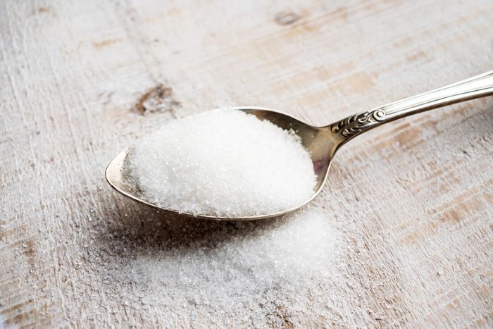 Artificial Sweeteners and Sugar Substitutes in metal spoon. Natural and synthetic sugarfree food additive: sorbitol, fructose, honey, Sucralose, Aspartame