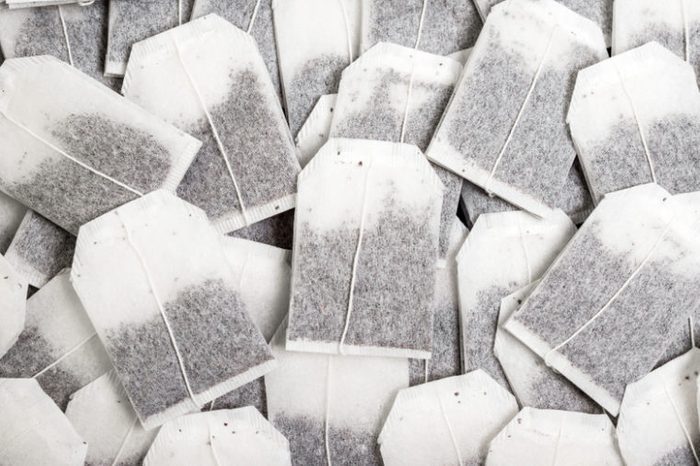 Close-up, a bunch of tea bags lie chaotically.