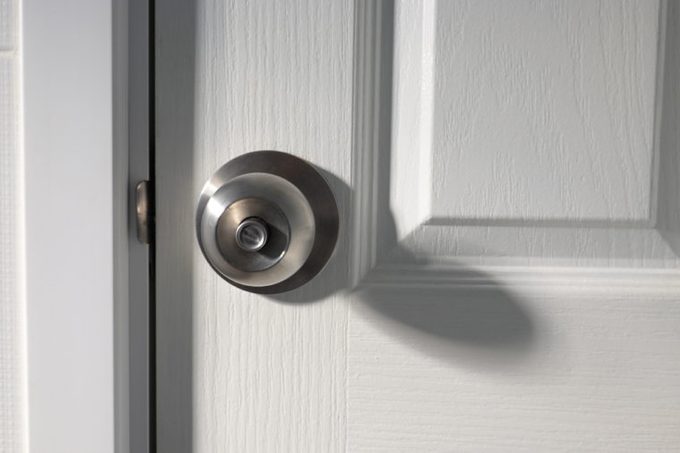 A doorknob on a wooden door