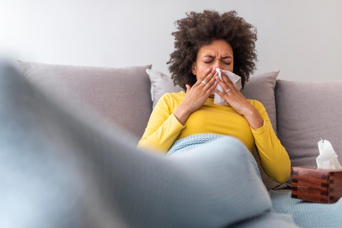 woman blow nose sneeze allergies sick