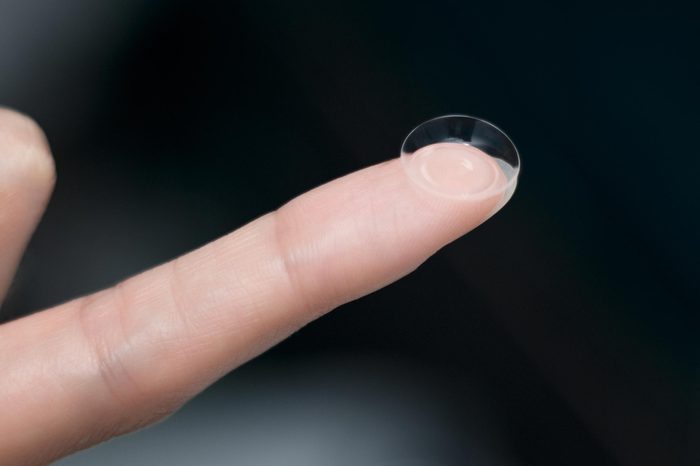 Contact lens on a finger.