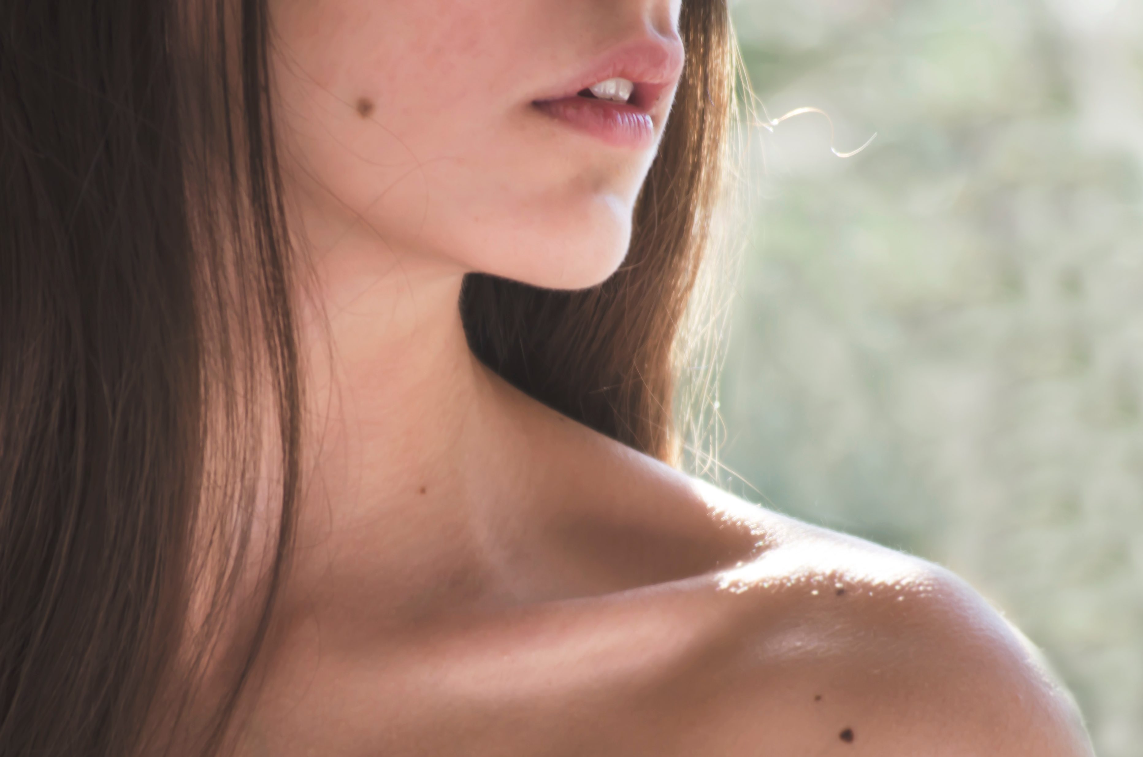 close up of young woman's neck and shoulder