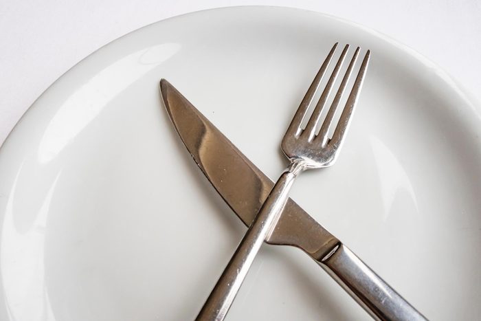 close up fork and knife on plate