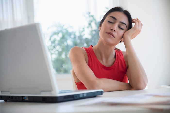 fatigued woman working