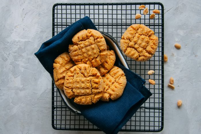 Peanut butter cookies in a dish and on a wire rack