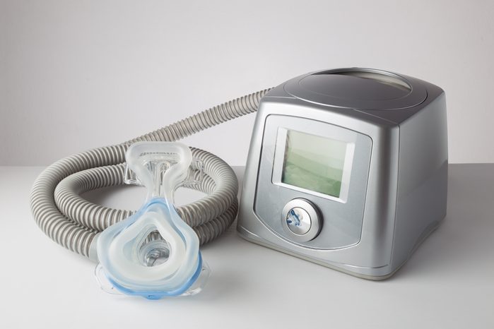 CPAP machine with mask and hose, for people with sleep apnea, respiratory, or breathing disorder