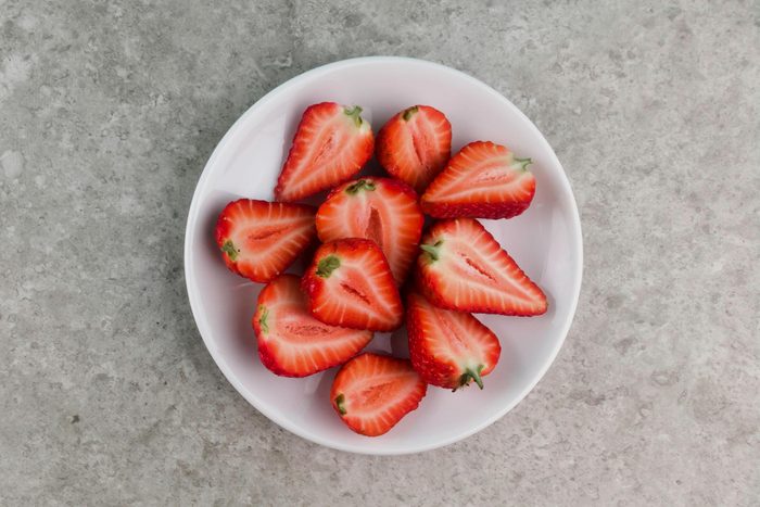 Strawberries slice in a white plate