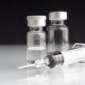 Syringe and vials closeup with selective focus and crop fragment. Medical and Healthcare Concept