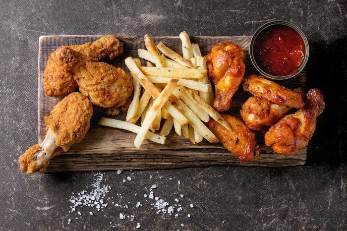 Fried chicken drumsticks with french fries
