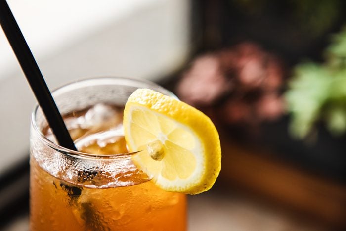 close up of glass of iced tea with lemon