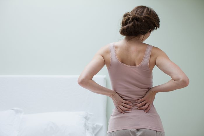 rear view of woman with aching back
