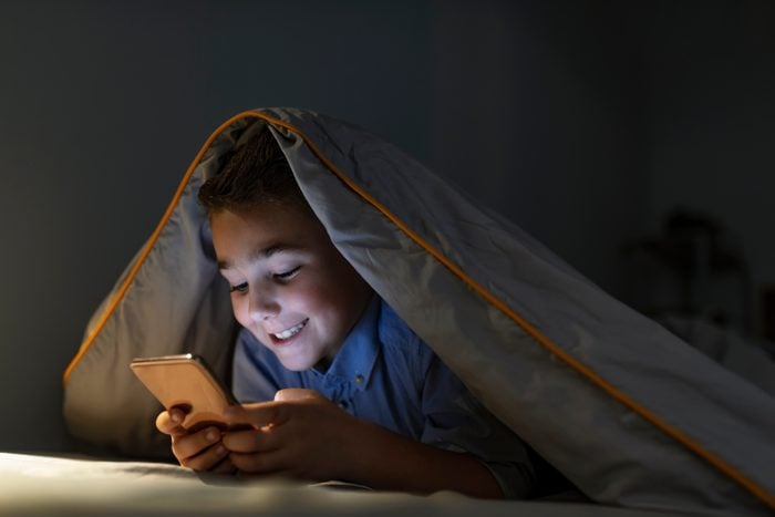 child kid boy cellphone before bed sleep